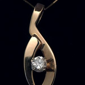 The 14kt gold Fashion diamond pendant, round diamond .57ct. color white near colorless clarity SI3. 18" gold chain attached.